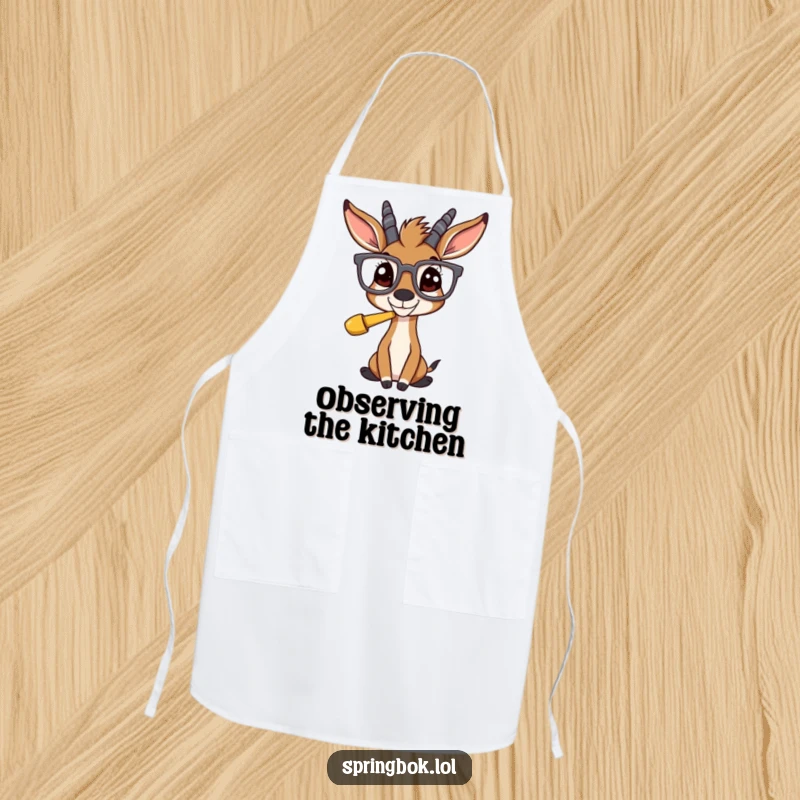 Funny springbok wearing large glasses, looking bewildered at a funny item, on a practical and amusing kitchen apron.