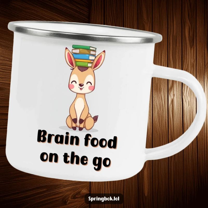 Funny springbok camping mug showing a happy springbok balancing a stack of books on its head, perfect for outdoor reading.
