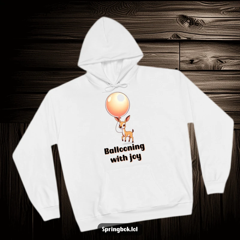 Funny Springbok Balloon Hoodie: A springbok happily bouncing a huge, shiny balloon, bringing smiles and warmth.