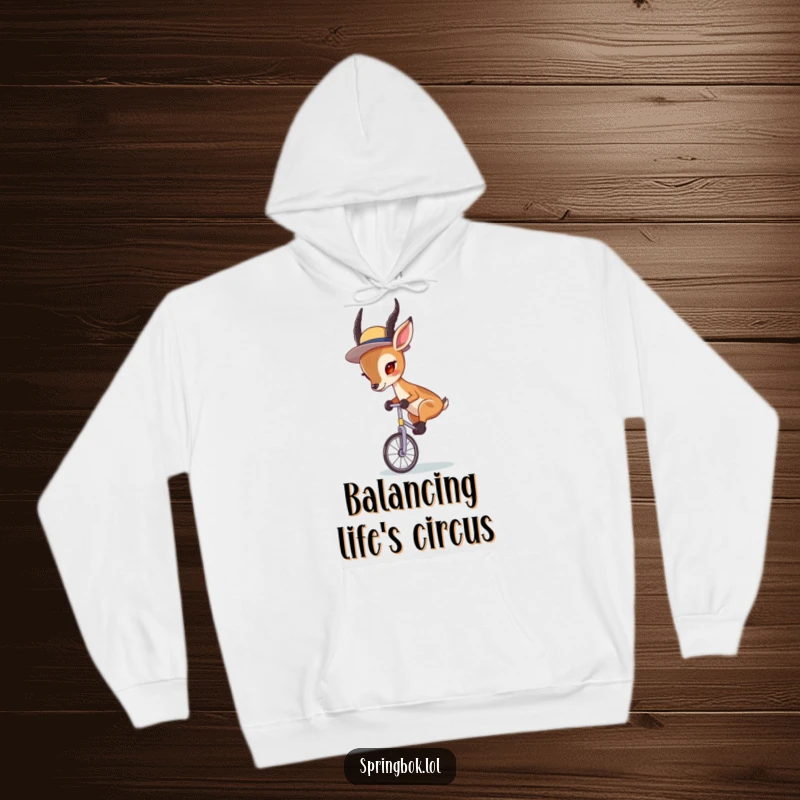 Funny Springbok Unicycle Hoodie: A springbok in a tiny hat, balancing precariously on a unicycle with intense focus.