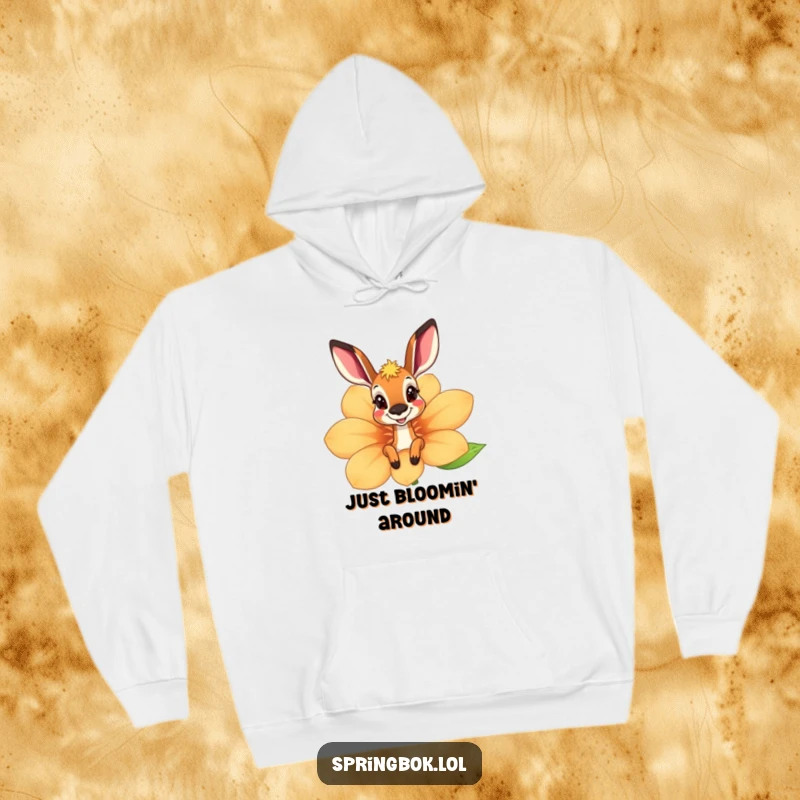 Funny springbok hoodie peeking playfully from behind a giant, cheerful flower, radiating warmth and a sense of fun.