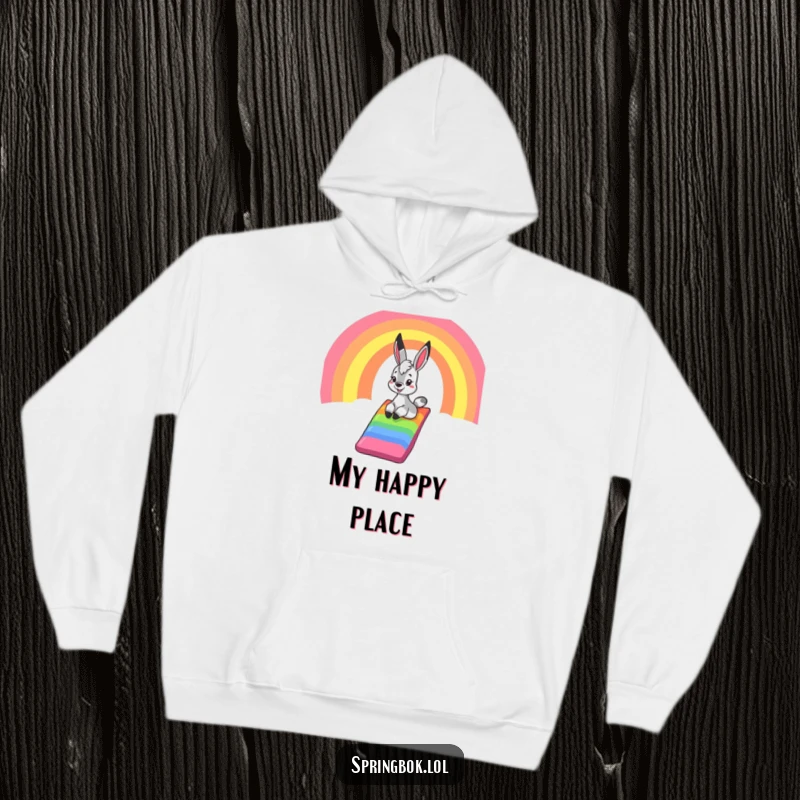 Funny springbok hoodie, a cozy garment showcasing a springbok's happy slide down a vibrant rainbow, radiating warmth and playful delight.