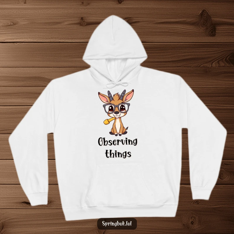 Funny springbok with huge glasses, staring with amusement at an unexpected item, on a warm, cozy hoodie.