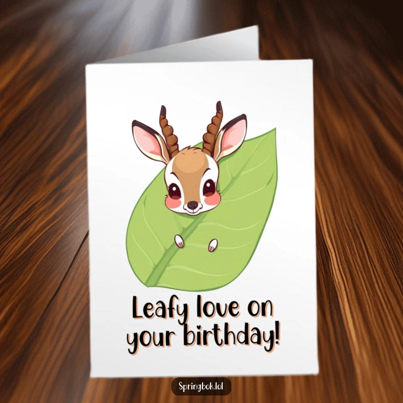 Funny Free Printable Birthday Card: Shy antelope peeking from a leaf, a humorous greeting.