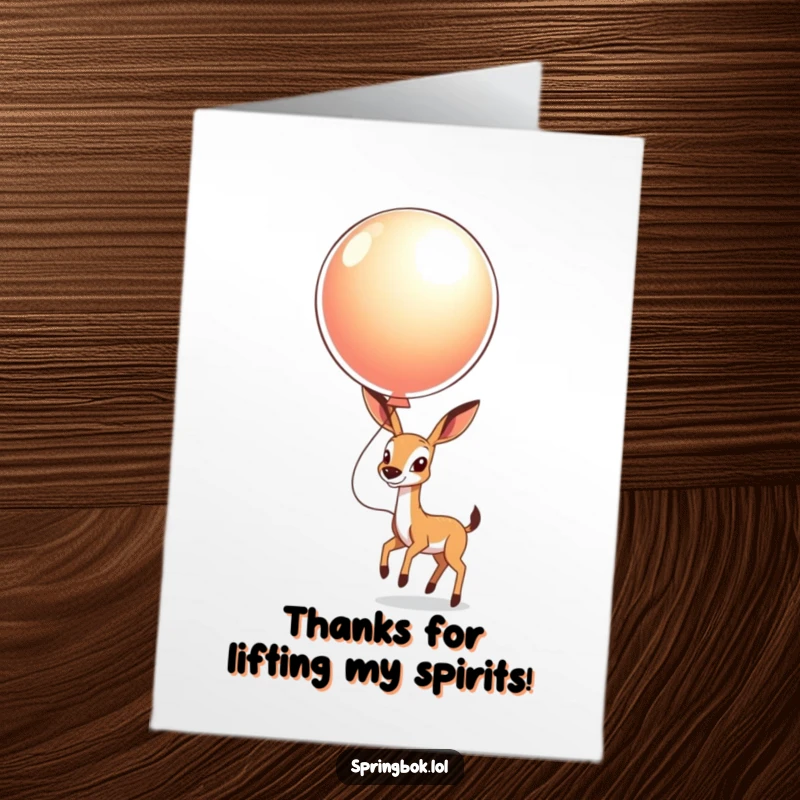 Funny Free Printable Thank You Card of a springbok gleefully bouncing a large, shiny balloon high in the sky.