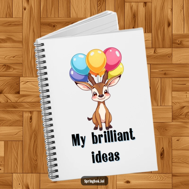 Funny notebook cover with a proud springbok character balancing colorful balloons on its nose, ideal for jotting down proud moments.