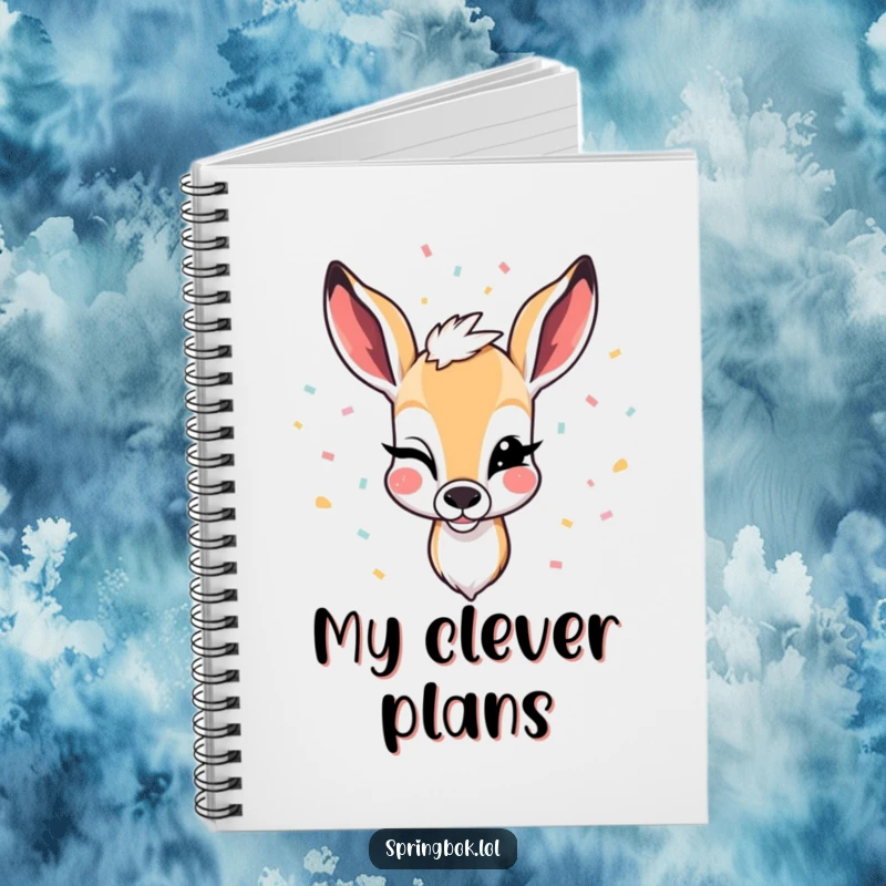 Funny notebook cover illustrating a springbok winking with confetti falling, ideal for journaling with a festive and humorous touch.