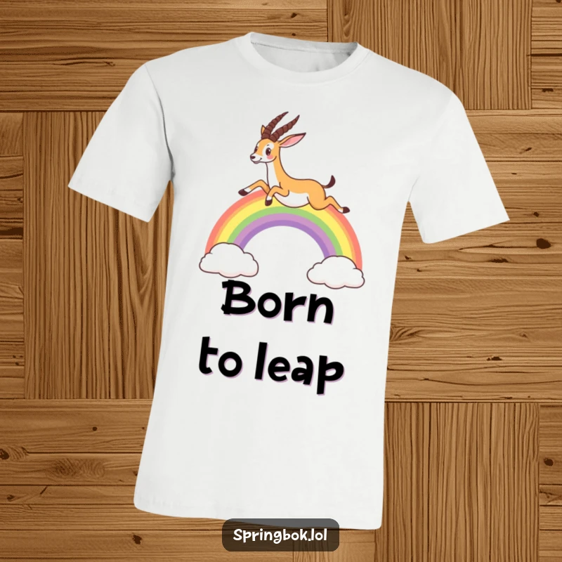 Funny t-shirt with a springbok gracefully leaping over a bright, arched rainbow, evoking feelings of joy and freedom.